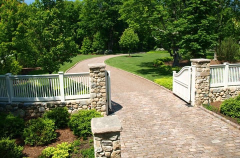 White pickett Fence with stone pillars 